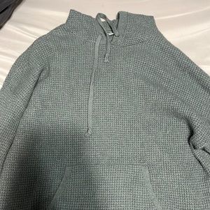 green knit sweatshirt